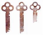 Three old keys isolated on a white background.
