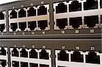 Closeup image of a network switch holes unplugged