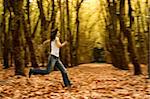 Woman runing in the Autumn Park -  Intentional blured efect