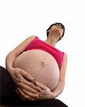 A pregnant young woman holding her belly