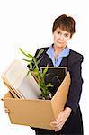 Middle aged woman laid off from her white collar job carries a box of her belongings.  Isolated on white.