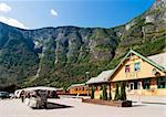 The small tourist town of Flam (flåm) on the western side of Norway deep in the fjords.  The flåm railway station and aurlandsfjord are in view.