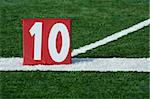 A red Football ten yard marker