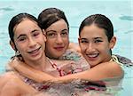 Three girlfriends in a swimming pool