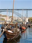 Cityscape with a typical porto wine rebelo boat in the foreground