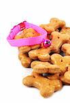 Dog biscuits and bell isolated.
