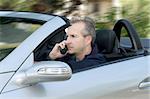 Man driving a convertible car