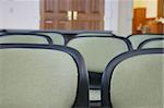 close-up view of row of chairs in meeting area