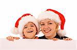 Woman and boy with santa hats behind a white banner - isolated over white