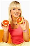 Happy beautiful women with holding grapefruit