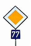 traffic sign priority with the number 77