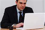 Businessman working on white computer