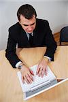 Successful young businessman working on laptop