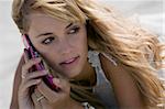 Attractive blonde woman talking with a mobile-phone outdoor