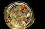 Bunch of golden coins savings in jar