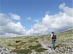 Woman hiking in the wilderness of a national park - Rondane - Norway