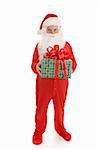 Santa in his footy pajamas ready for bed.  He is holding a wrapped gift.  Full body on white background.