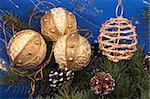 Festive Christmas composition with Christmas tree branch, pine-cones and  holiday balls