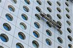 Window cleaners working on a business building