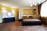 Bedroom with a mirror on a wall in hotel