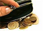 Female fingers open a purse with Russian coins