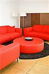 Red sofas in the living room with lamp
