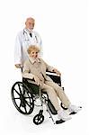 Pretty senior woman in a wheelchair being pushed by her doctor.  Full body isolated on white.