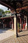 Inner courtyard of traditional chinese temple with pillars and tiles