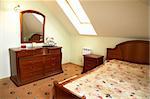 Beautiful bedroom with a wide bed in modern hotel