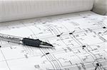 pen and architectural plans close up