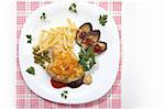 appetizing dish: chicken fillet with green peas, fry potatoes and grilled aubergine