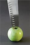 Kitchen knife and apple