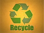 green recycling symbol on yellow cardboard background