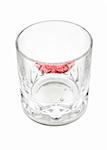 whisky glass with red lipstick isolated on white