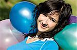 Beautiful teen in balloons background