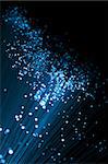 Fiber optic strands in cold blue tones, shallow DOF