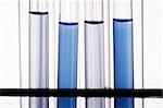 A bunch of test tubes in plain background.