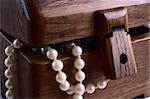 wooden hand-made casket with white pearl beads