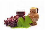 Red Wine with grapeleaf and wine jug.