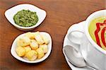 Spinach puree, bread croutons and parsley on wood background. Shallow DOF