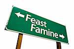 Feast or Famine road sign isolated on a white background. Contains Clipping Path.