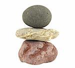 Pile of balanced stones representing meditation isolated in white
