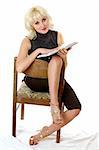 blondie in black reading on a chair, white background