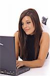 gorgeous girl checking emails on laptop vertical