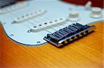 Close-up of a Fender American Deluxe guitar bridge