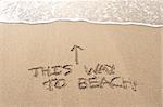 This way to beach written in the sand at Haumoana Beach, Hawke's Bay, New Zealand