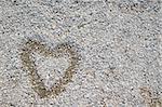 painted heart over small stones and rocks