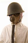 Person in gas mask on white background