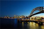 famous sydney landmarks - opera house, harbour bridge, sydney tower, port jackson. color reflections in water