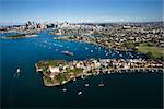 Aerial view of boats in Snails Bay with view of downtown skyline in Sydney, Australia.